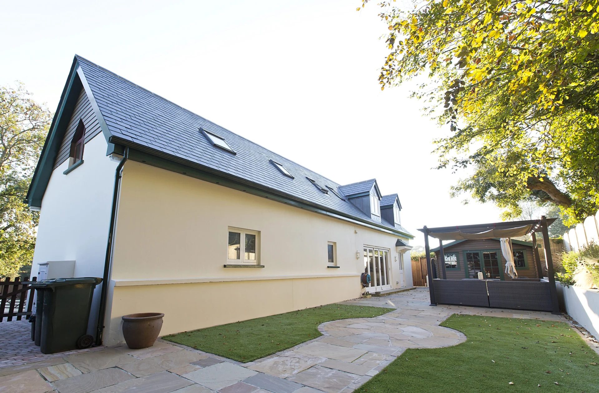 Modern house exterior with garden and patio