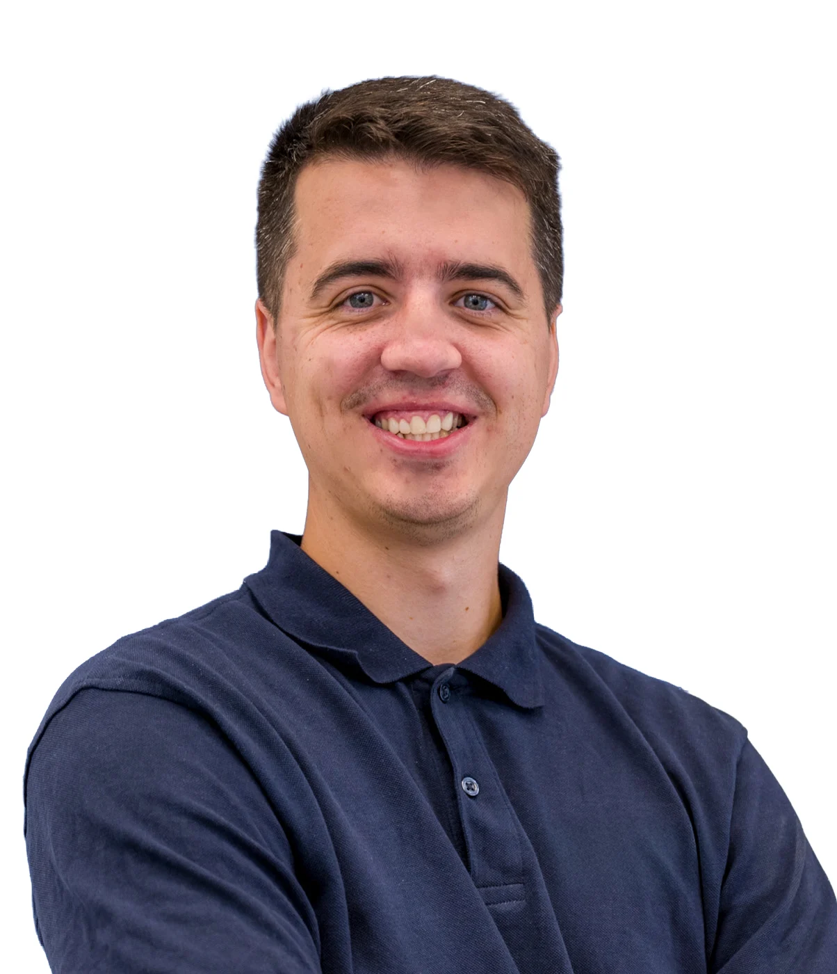 Smiling man in navy polo shirt against white background
