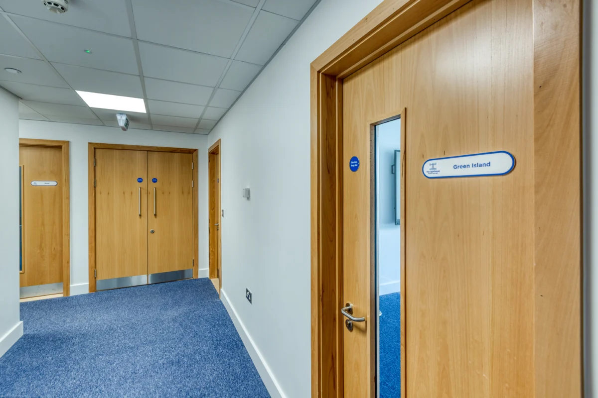 Corridor with wooden doors in office building
