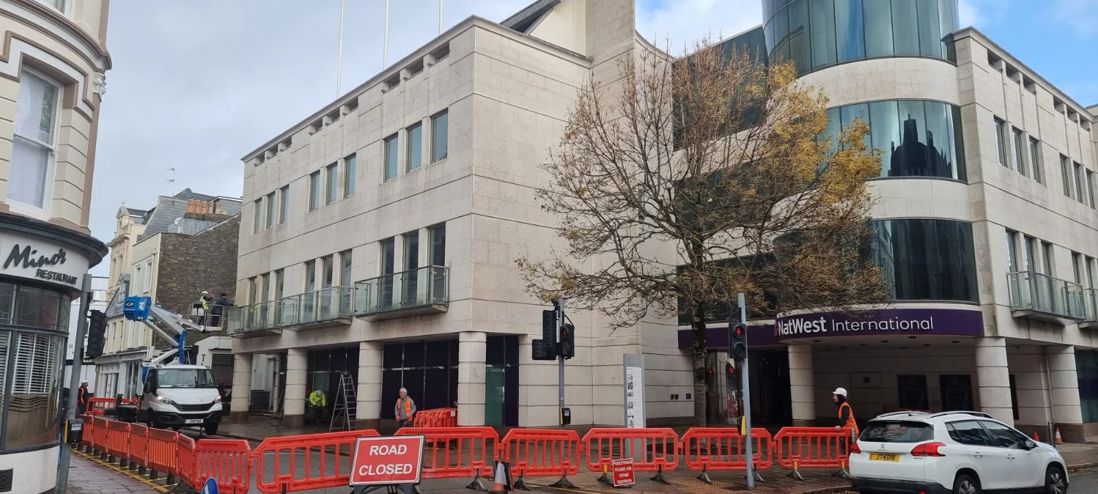 Road closure near NatWest International building.