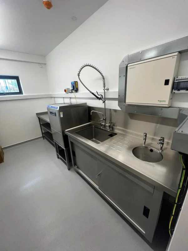Commercial kitchen stainless steel sinks and fittings.