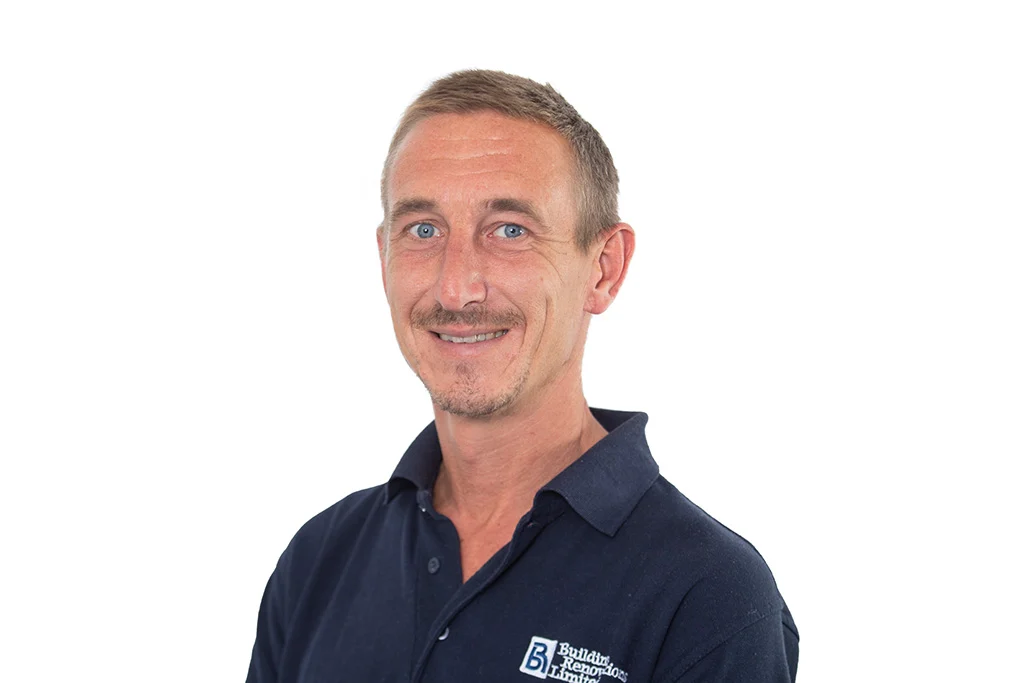 Smiling man in navy shirt portrait