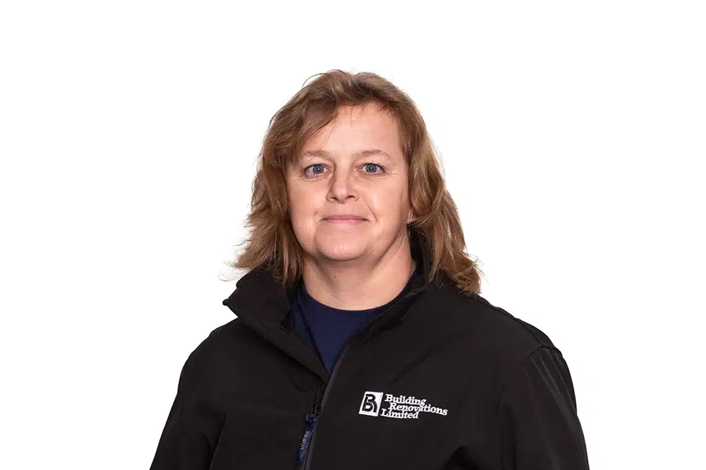 Person in black jacket with building company logo.